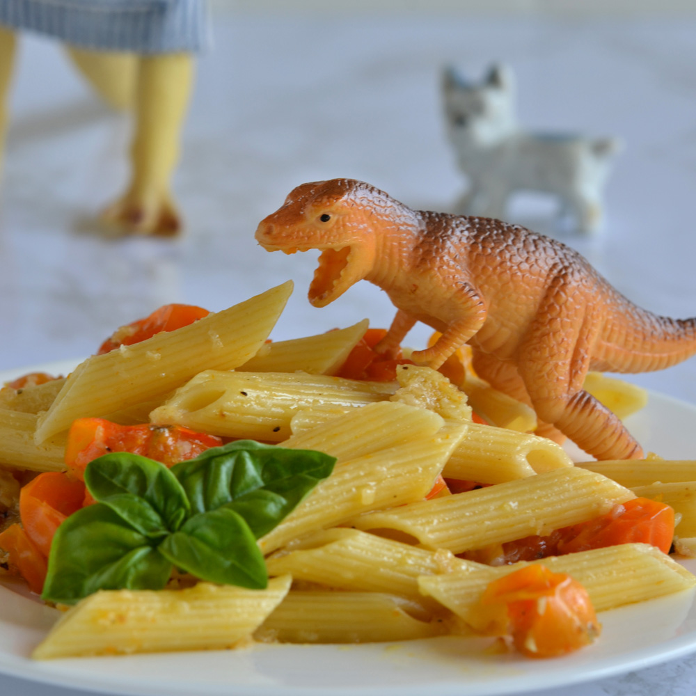 Blondie eating penne with garden tomatoes