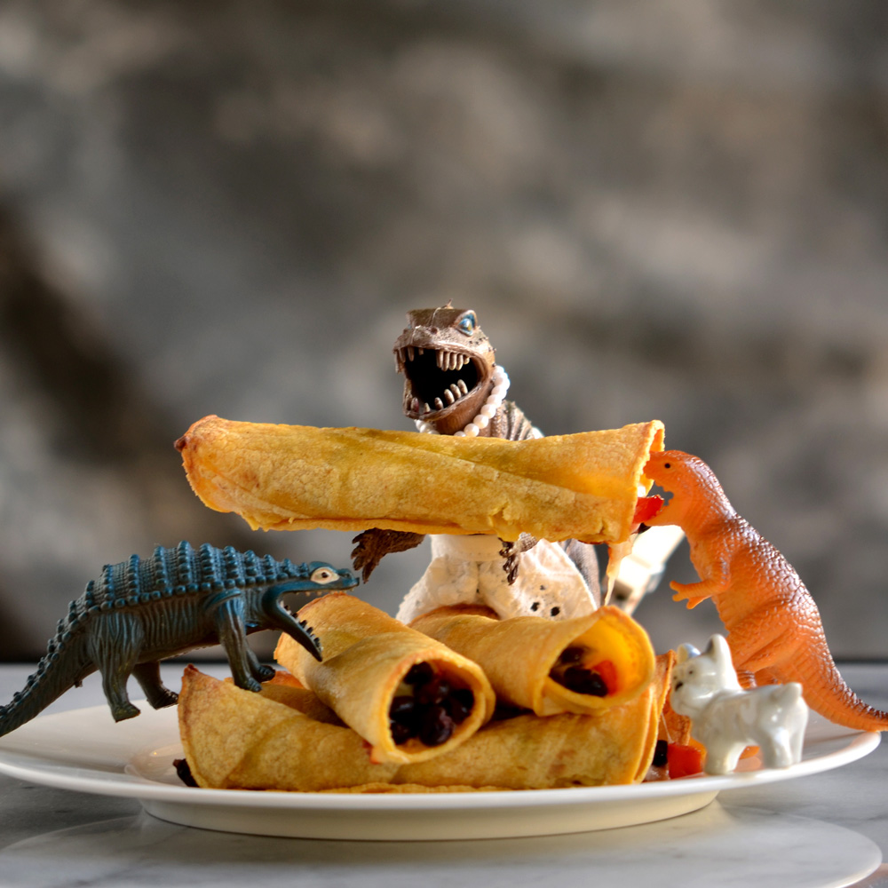 Vickie, Alex, and Blondie with plate of flautas