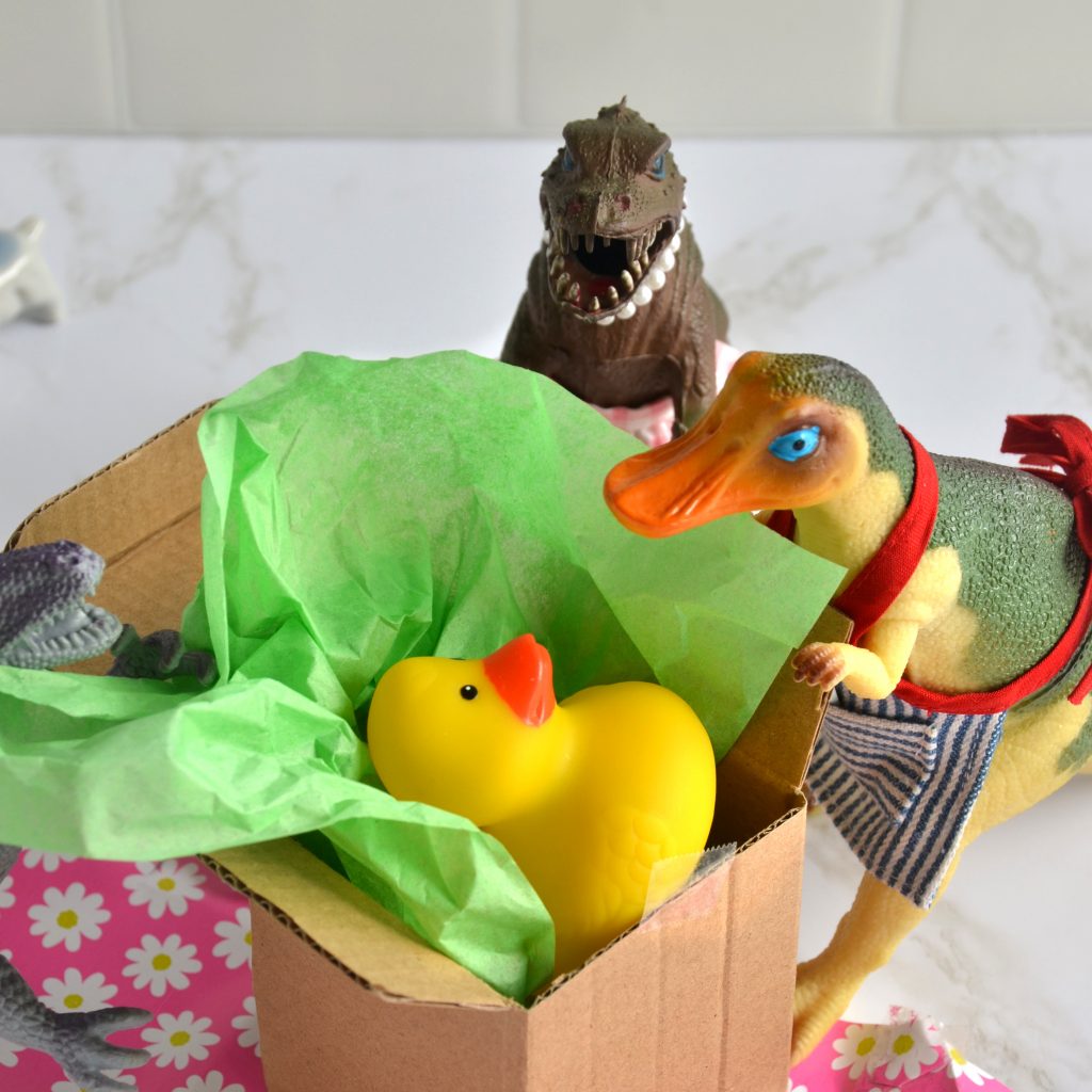 TJ unwraps a rubber ducky for their birthday