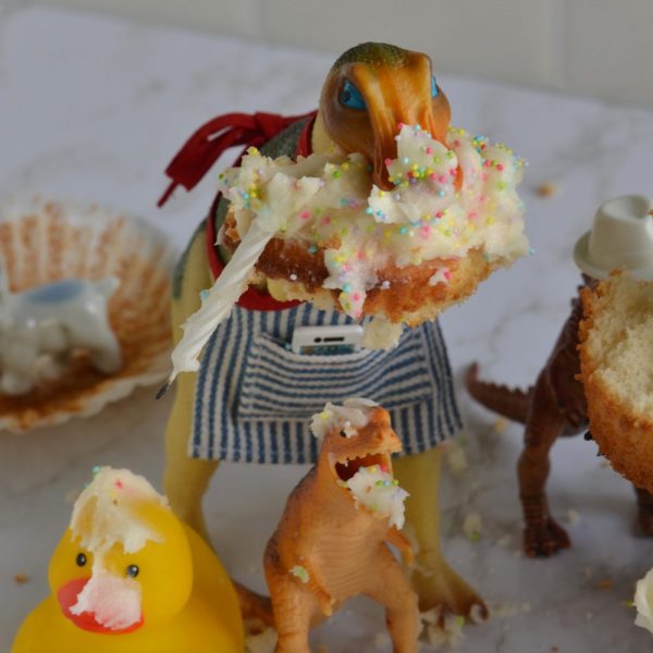 TJ is messy with part of their birthday cupcake